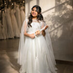 Cressida Holy Communion gown for girls in white with cape sleeves and embroidered bodice