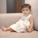 Premium white baptism blessing dress for baby girl used during Catholic baptism ceremony and priest's blessing prayers.