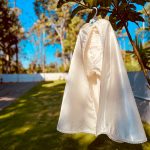 Luxury ivory baby boy baptism outfit with personalised satin romper and full-length ceremonial cape.